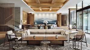 A spacious lobby with a wooden ceiling, a large sofa, and a dining area with tables and chairs. - JW Marriott Hotel Nara (Nara)
