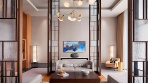 A modern hotel lobby with a central seating area, a large painting on the wall, and a chandelier. - JW Marriott Hotel Nara (Nara)