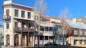 A historic building with a balcony and a sign reading "South Main".