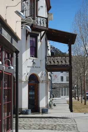 A building with a sign reading "SOUTH MAIN" and a covered entrance.