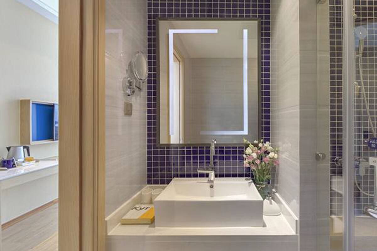 shower, hair dryer, slippers, towels