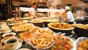 A buffet with various dishes and sauces. - Luxury Villas - Villa Danang Beach (Da Nang)