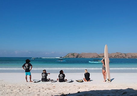 Beach nearby, white sand, beach towels