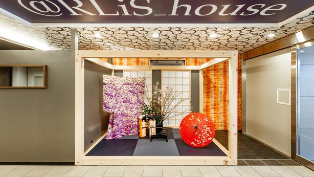 A reception area with a sign reading "@RLiS_house" and a traditional Japanese interior design. - At RLiS House Tsutenkaku (Osaka)