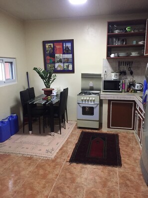 Fridge, microwave, oven, cookware/dishes/utensils