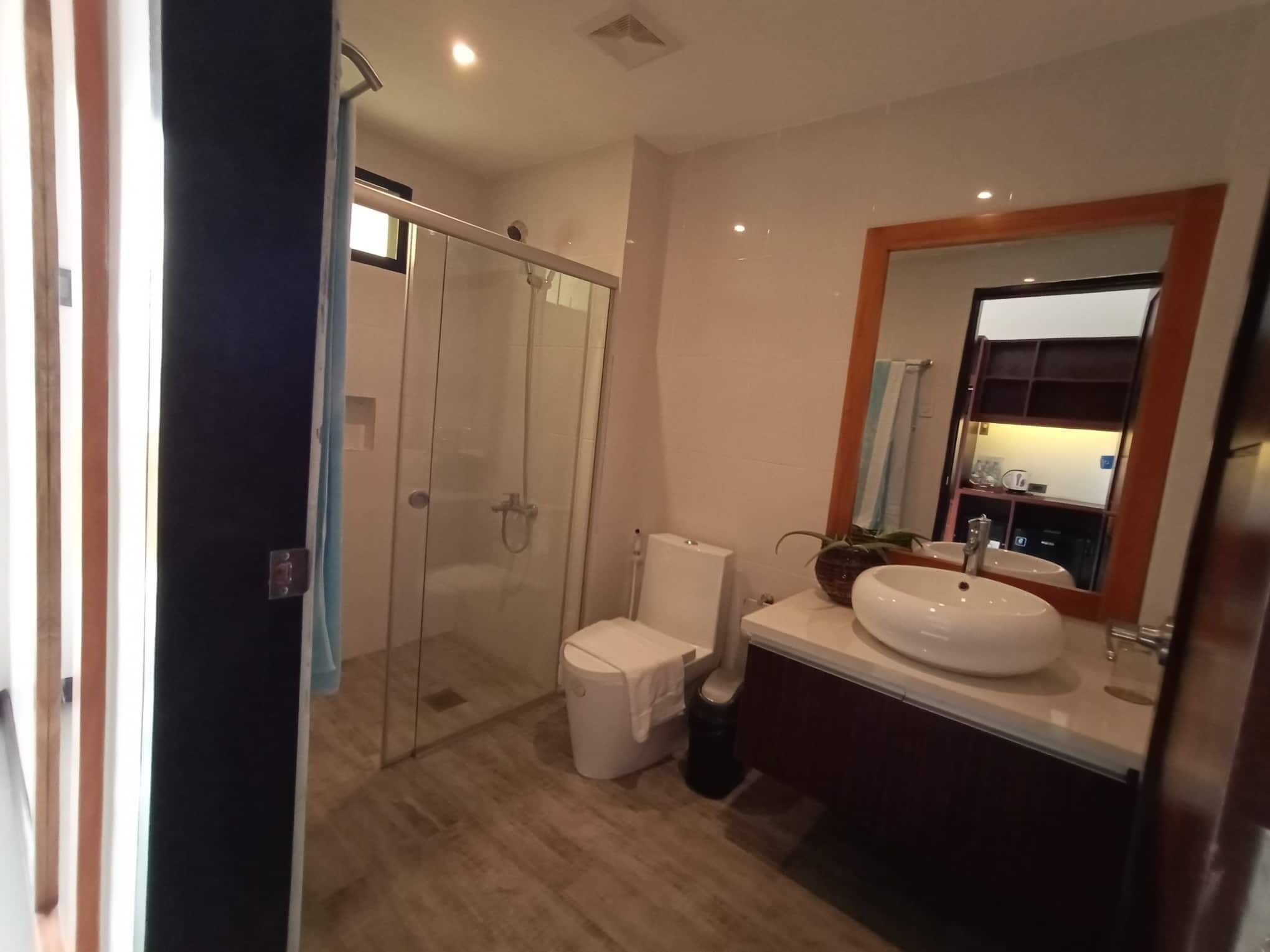 deluxe triple room | bathroom | shower, free toiletries, hair dryer, slippers