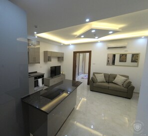 Apartment | Living area | 30-inch TV with digital channels - Amazing one Bedroom Apartment in Amman,elwebdah 1 (Amman)