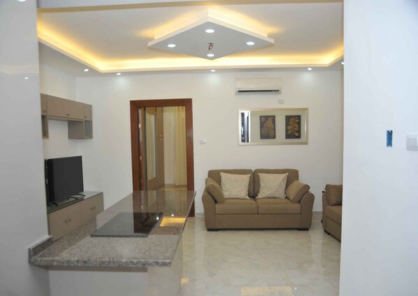 Apartment | Living room | 30-inch TV with digital channels - Amazing one Bedroom Apartment in Amman,elwebdah 6 (Amman)