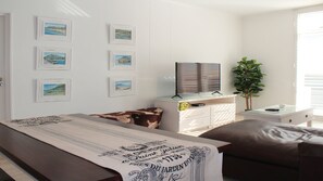 Apartment, 1 Bedroom | Living area | 32-inch flat-screen TV with satellite channels, TV - Endless Summer Muizenberg Beachfront (Cape Town)