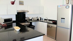 Apartment, 1 Bedroom | Private kitchen | Full-size fridge, microwave, oven, stovetop - Endless Summer Muizenberg Beachfront (Cape Town)