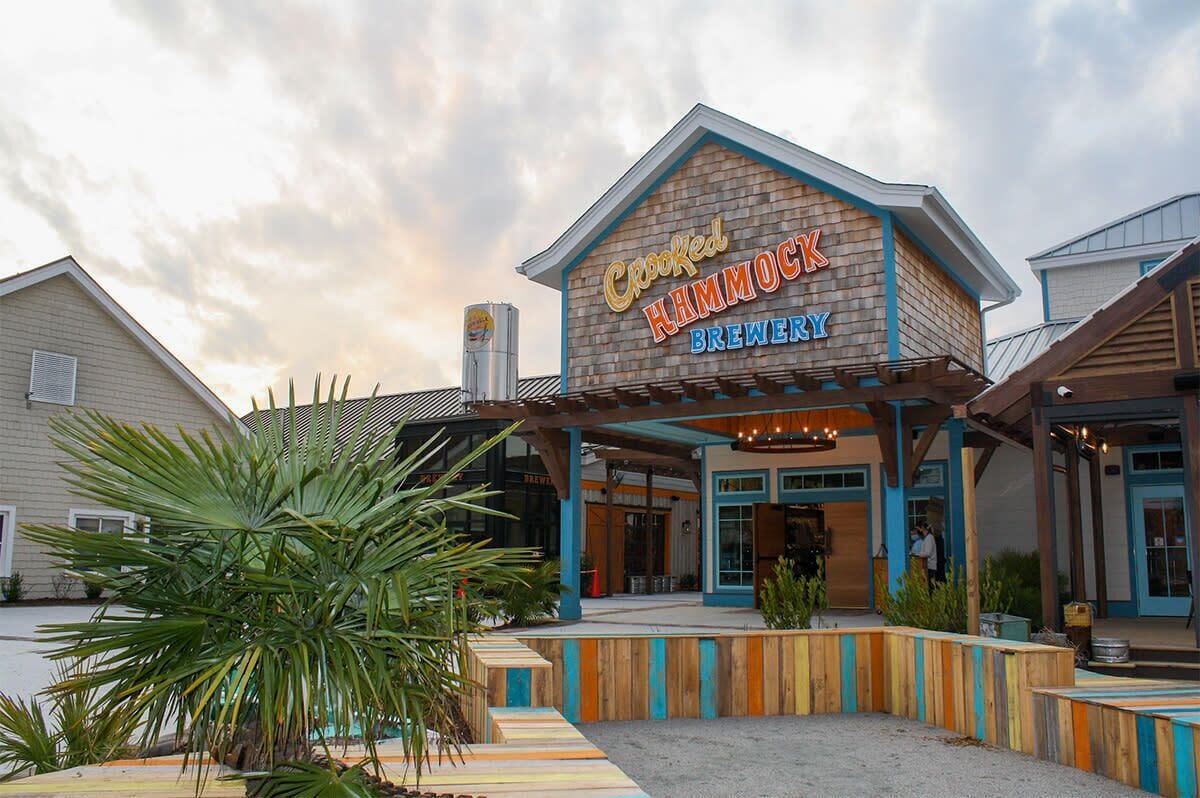 Crooked Hammock Brewery with a wooden exterior and a covered patio area.