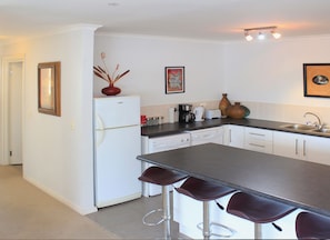Apartment, 2 Bedrooms, Balcony | Private kitchen | Full-size fridge, microwave, oven, stovetop - Beachside Villa Muizenberg Beachfront (Cape Town)