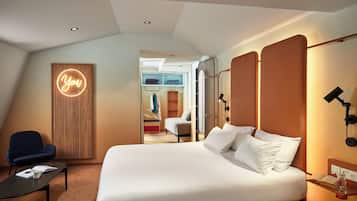 Premium bedding, laptop workspace, blackout drapes, soundproofing