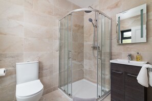 Shower, hair dryer, towels, soap