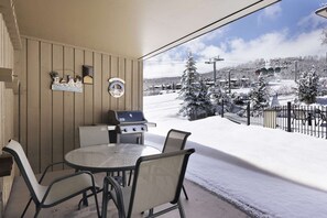 Outdoor dining - Mountain Views & Patio! Steps to Pool/Hot Tub, W/D, Covered Parking, Walk to Shops & Dining (Snowmass Village)
