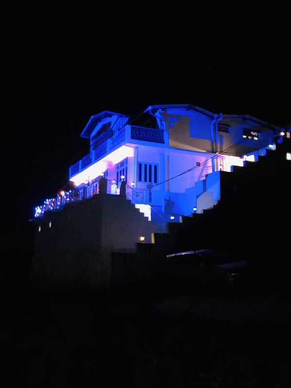 A building with a balcony and a staircase leading up to it. - Aqua De Vida Resort (Nainital)