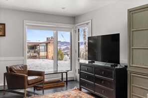 TV, fireplace, books, offices