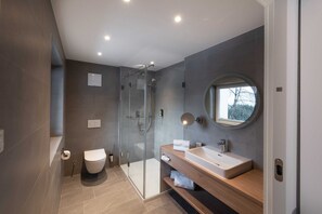 Shower, rainfall showerhead, hair dryer, towels