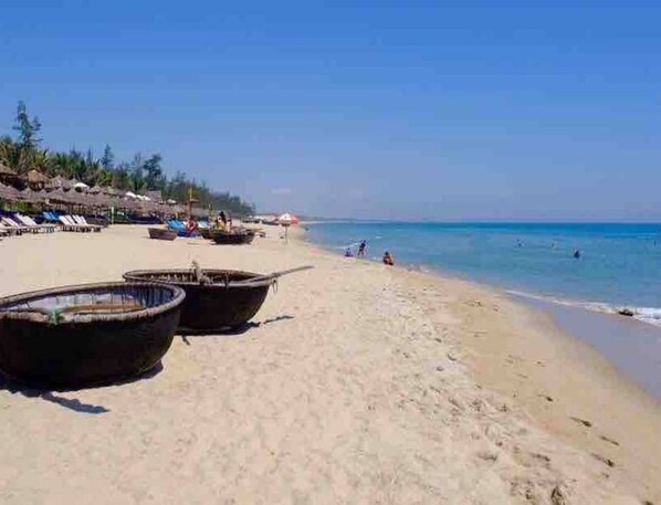 On the beach, sun loungers, beach towels