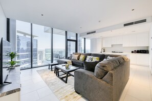 Deluxe Apartment, 3 Bedrooms (2504) | Living area | Flat-screen TV - Maison Privee Marquise Square (Dubai)