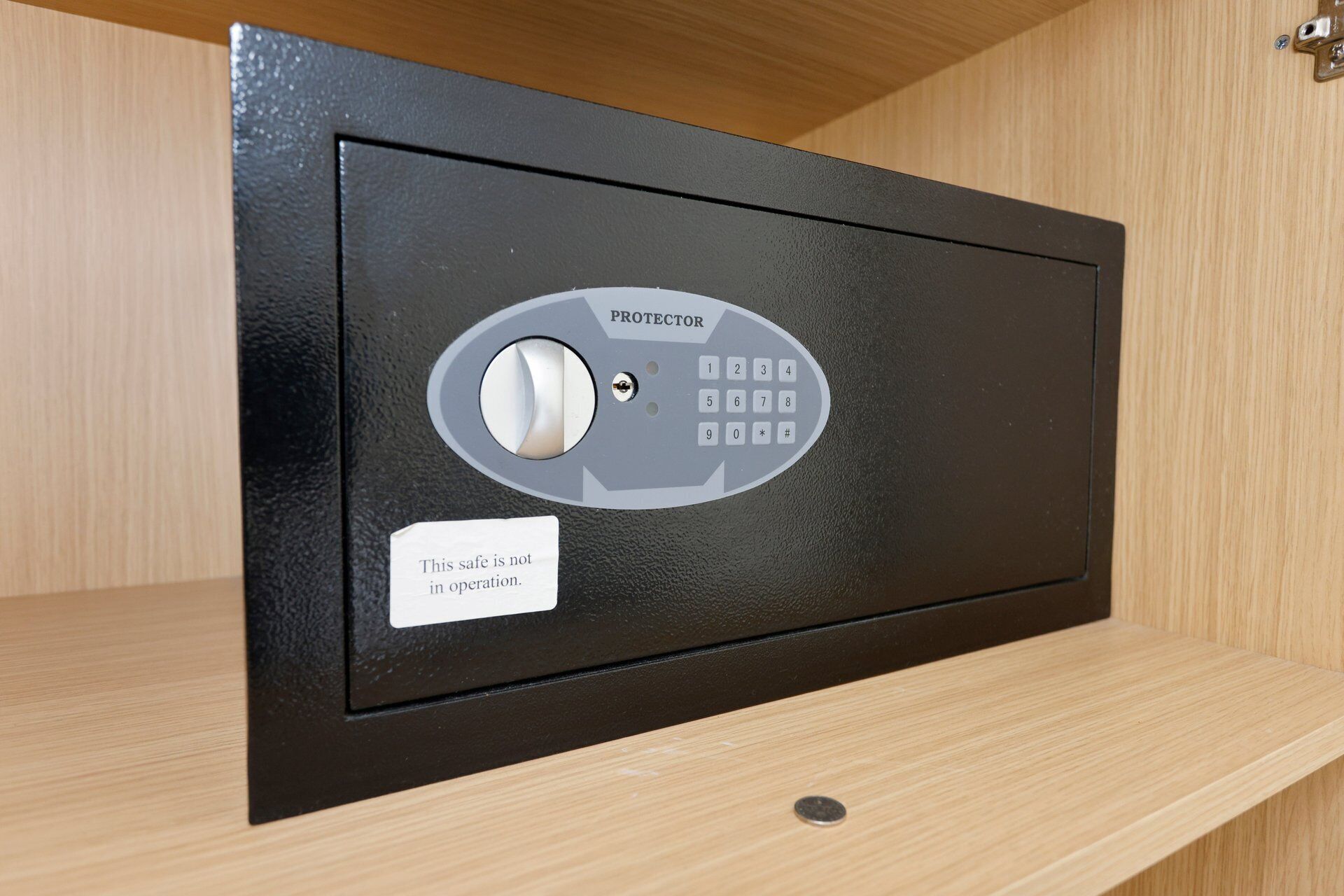 A safe with a keypad and a note stating it's not in operation.
