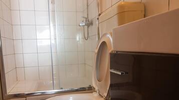 Shower, free toiletries, towels, soap