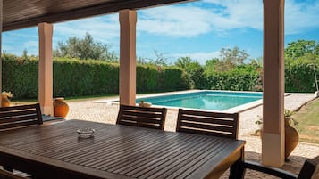 Seasonal outdoor pool, open 7:30 AM to 10:00 PM, sun loungers