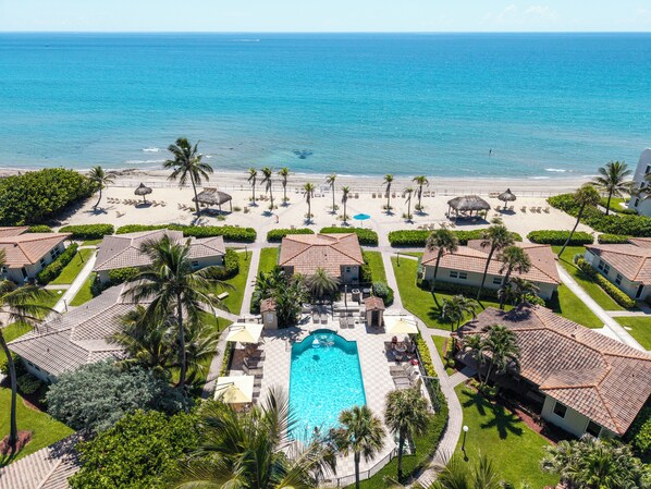 A resort with a swimming pool, beach, and ocean view. - Ocean Side Cottage - lovely living in Villa U1 (Hillsboro Beach)