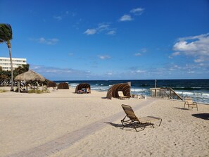 On the beach, sun-loungers, beach towels