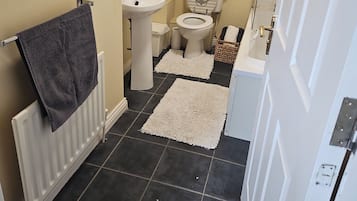 Combined shower/bathtub, deep-soaking bathtub, hair dryer, towels
