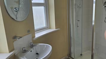 Combined shower/bathtub, deep-soaking bathtub, hair dryer, towels