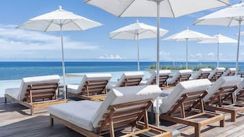 2 outdoor pools, open 7:00 AM to 7:00 PM, pool umbrellas, pool loungers