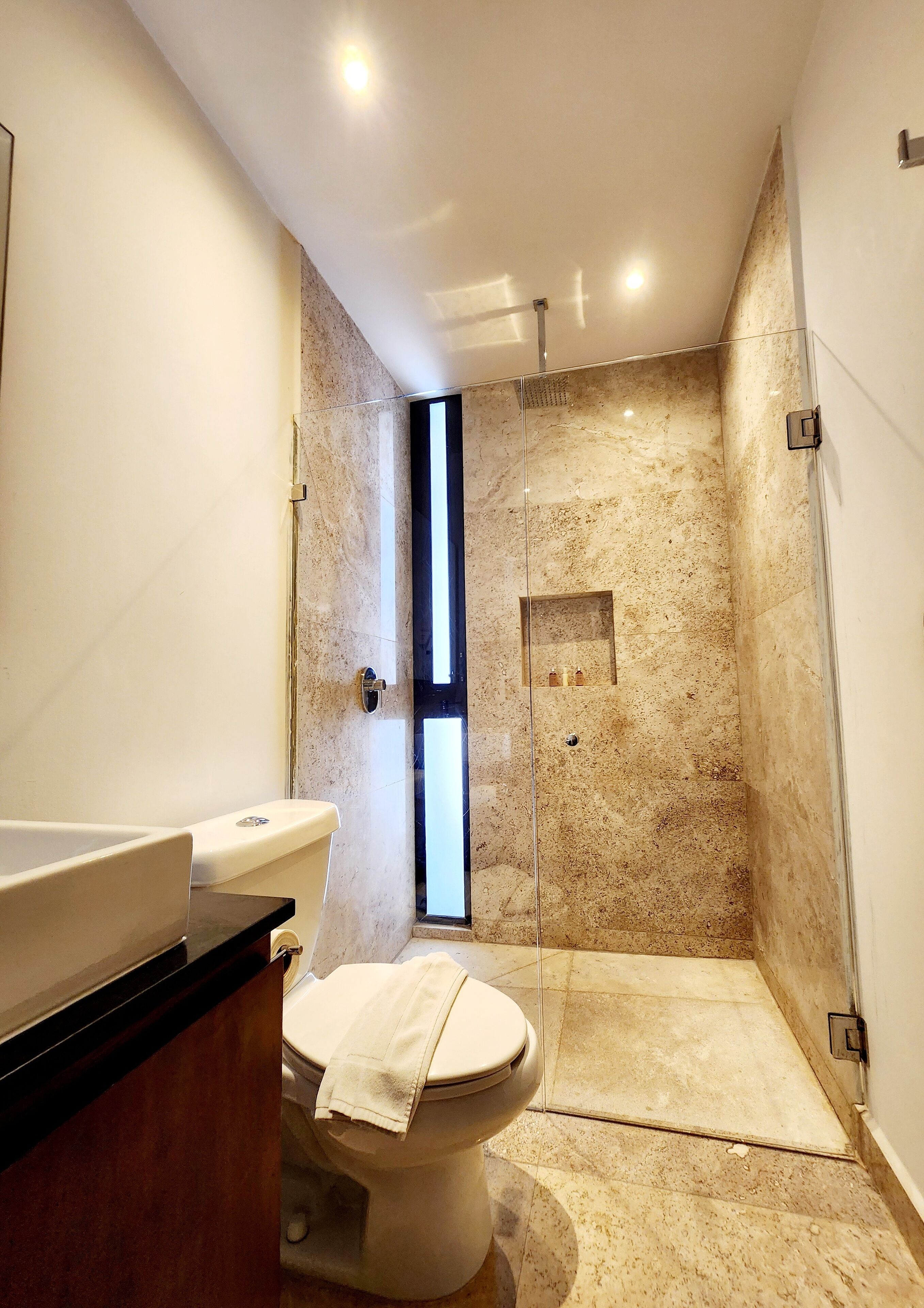 premium studio suite | bathroom | shower, designer toiletries, hair dryer, heated floors