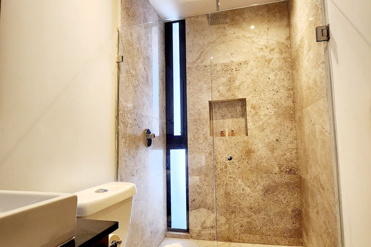 premium studio suite | bathroom | shower, designer toiletries, hair dryer, heated floors