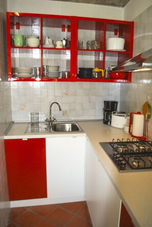 Fridge, coffee/tea maker, toaster, cookware/dishes/utensils