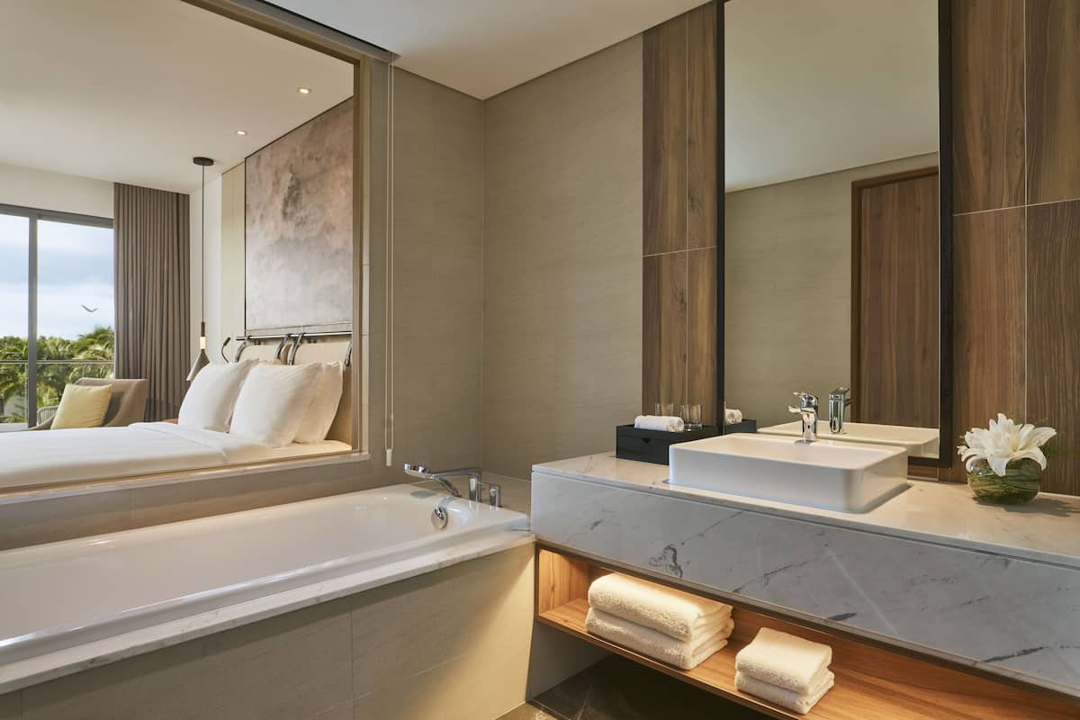 Separate tub and shower, rainfall showerhead, eco-friendly toiletries