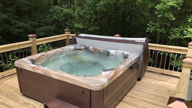 A hot tub on a wooden deck surrounded by trees. - 12 Bedroom XL HotTub 2 HOUSES~44ppl (Lookout Mountain)