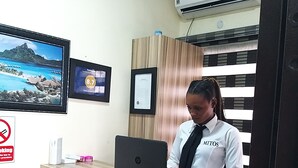 A reception desk with a laptop, framed certificates, and a no-smoking sign. - Mitos Luxury Suites (Lagos)