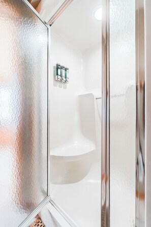 Combined shower/tub, hair dryer, towels, soap