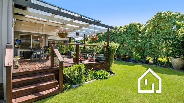 A modern house with a wooden deck, outdoor seating, and a well-maintained garden. - Simplicity & Serenity *1 NIGHT FREE* Charming Retreat, no Govt Tax (Blairgowrie)