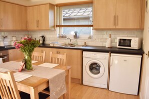 Microwave, coffee/tea maker, cookware/dishes/utensils