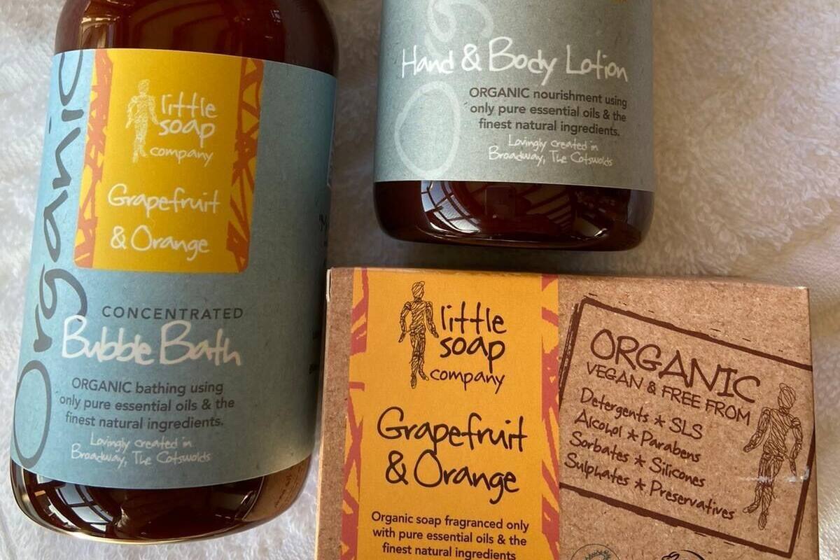 Two bottles of Little Soap Grapefruit & Orange body lotion and bubble bath, and a box of the same soap.