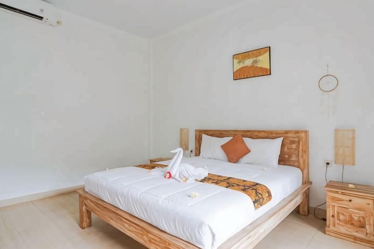 Minibar, desk, bed sheets