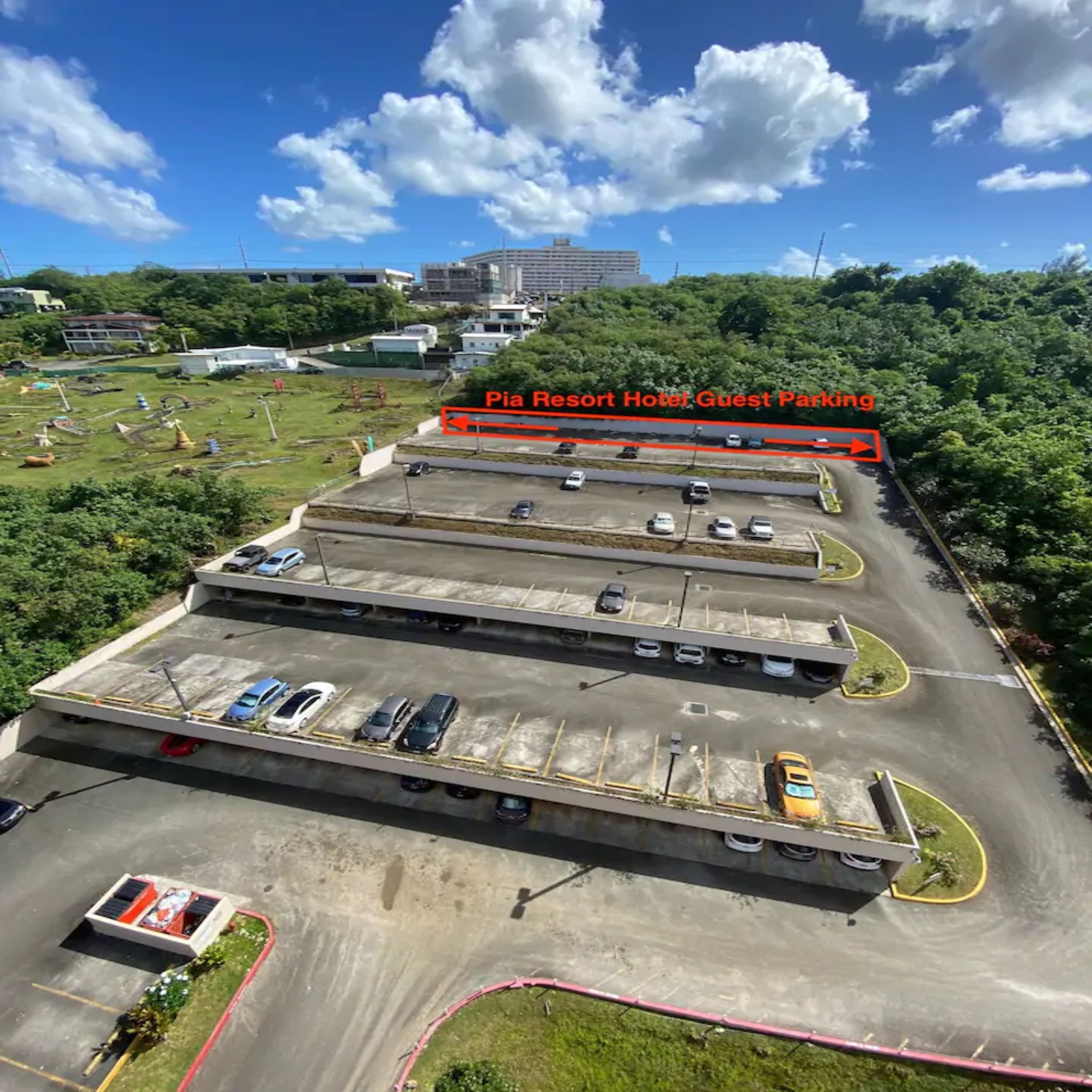 A multi-level parking structure with several cars parked.