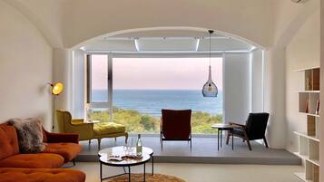 Deluxe Room (201) | Living area | LED TV, Netflix, books, pay movies