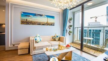 Family Apartment | Living area | 50-inch Smart TV with satellite channels, TV