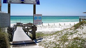 A beach entrance with a sign reading "Bay County Public Beach Access" and a wooden walkway leading to the beach. - Steps from the Beach Pet Friendly HUGE Discounts for Sept!!!! (Panama City)