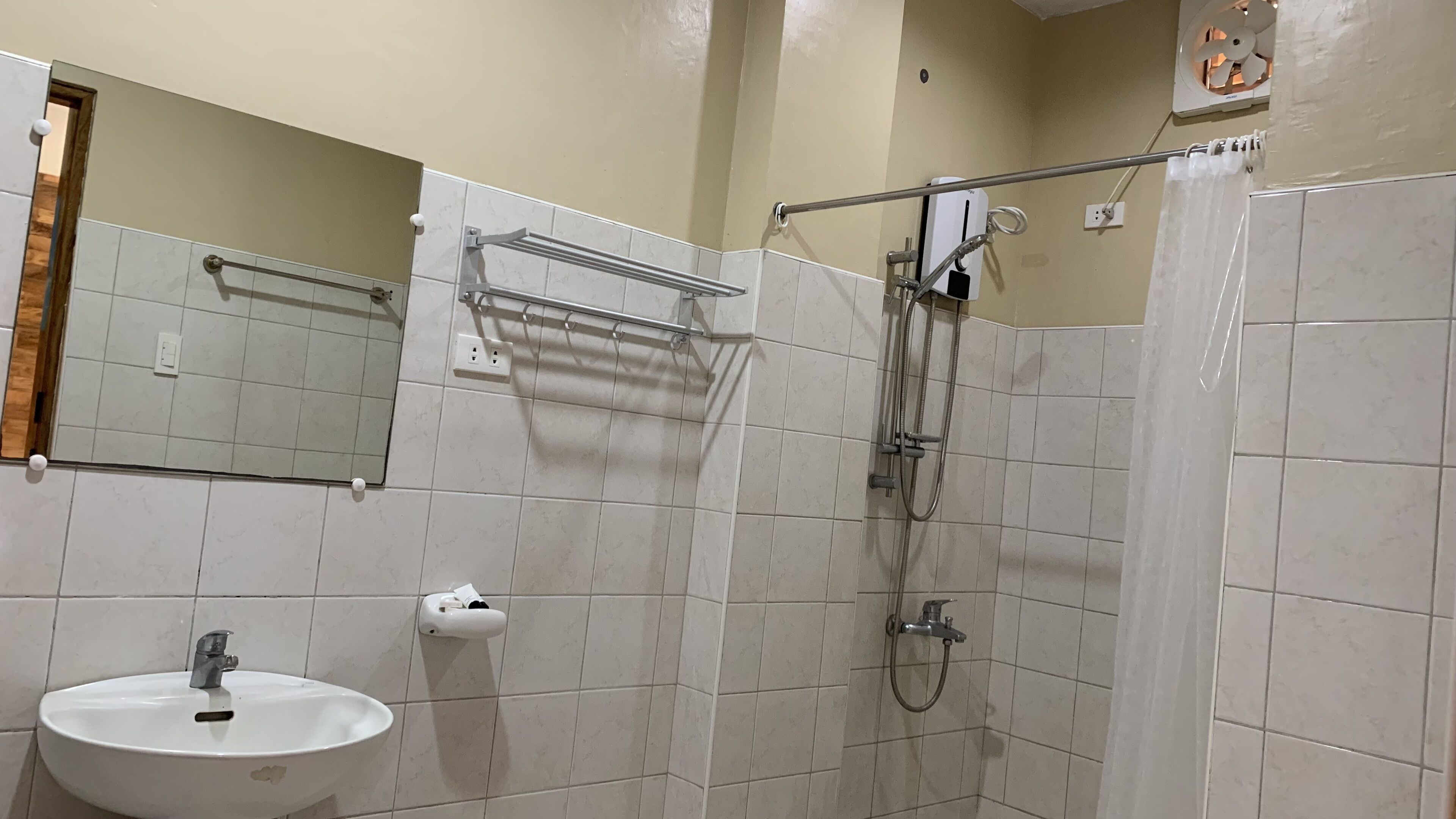 Shower, rainfall showerhead, bidet, towels