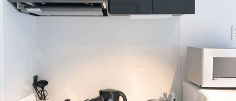 Nestay inn Tokyo Otsuka 201 | Private kitchenette | Fridge, microwave, stovetop, cookware/dishes/utensils