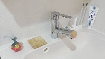 Nestay inn Tokyo Otsuka 203 | Bathroom amenities | Separate tub and shower, free toiletries, hair dryer, slippers